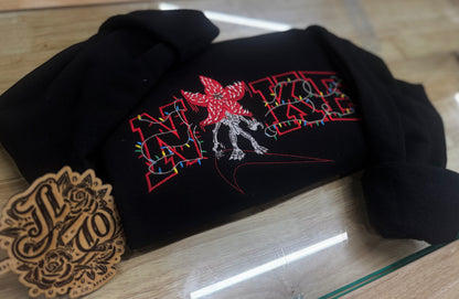 Embroidered swoosh demon crewneck