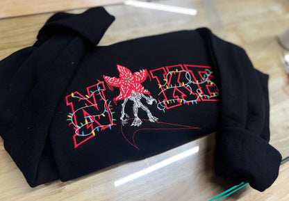 Embroidered swoosh demon crewneck