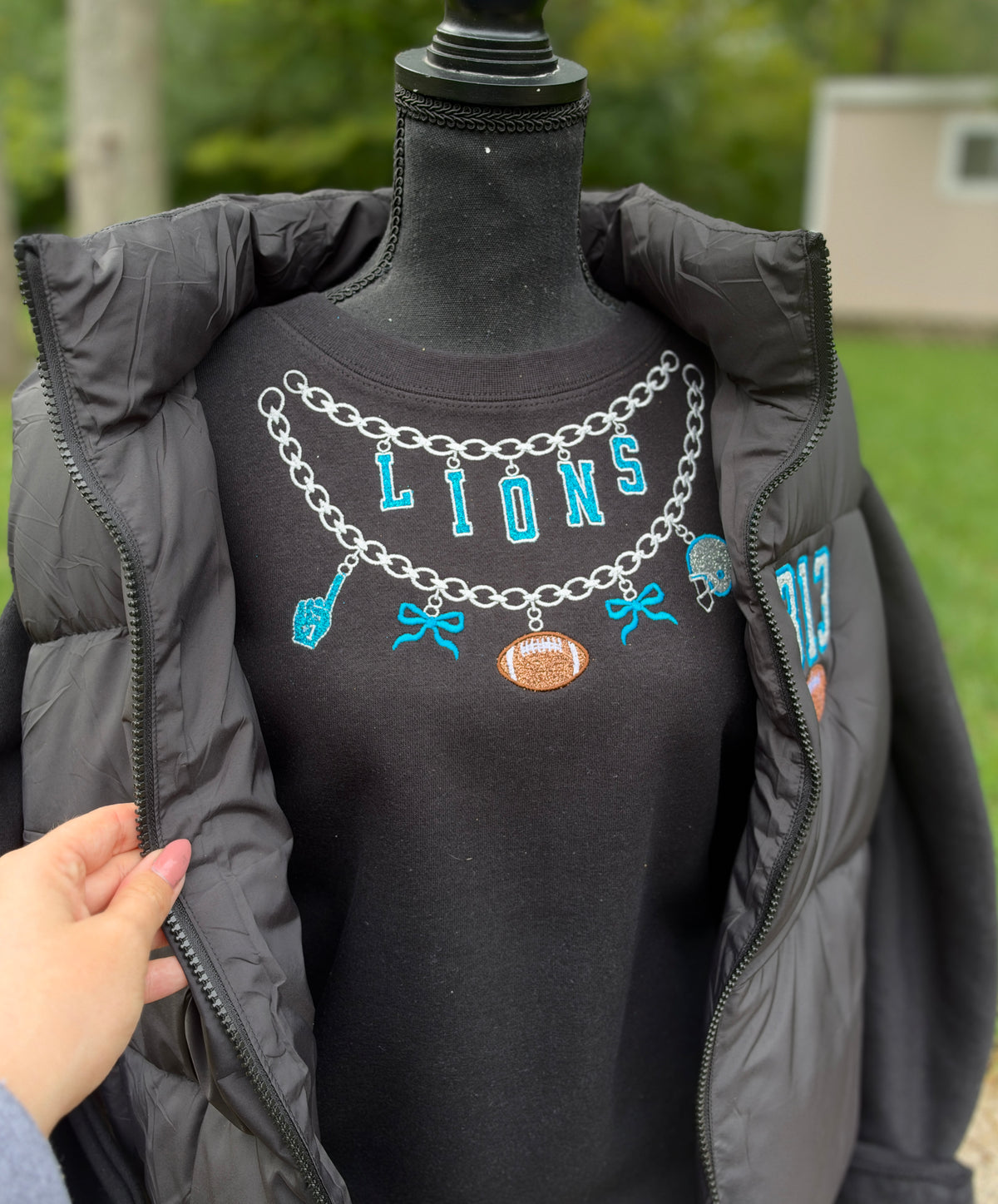 Embroidered charm football crewneck